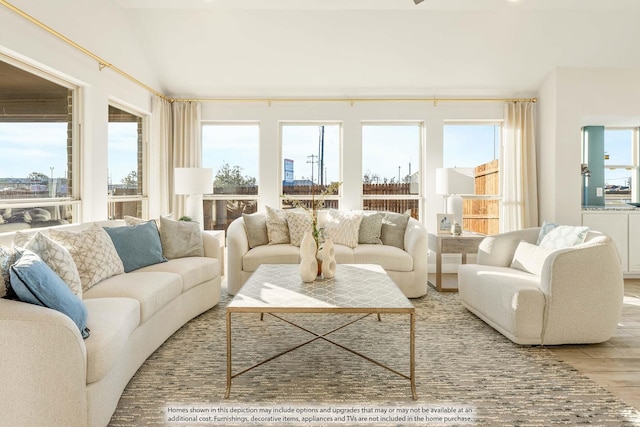 sunroom with vaulted ceiling and plenty of natural light