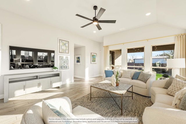 living room featuring baseboards, light wood-style flooring, ceiling fan, vaulted ceiling, and recessed lighting