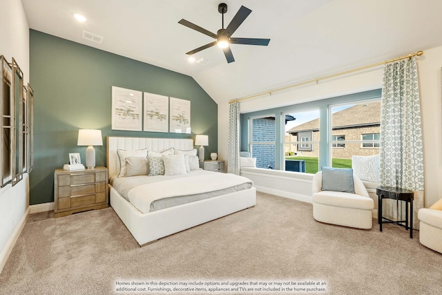 bedroom with lofted ceiling, carpet flooring, visible vents, and baseboards