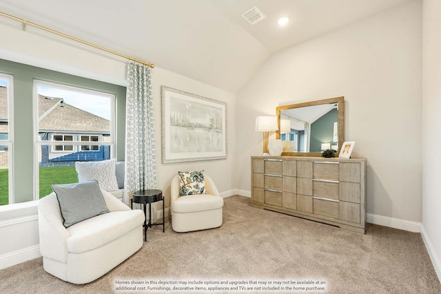 living area featuring carpet floors, lofted ceiling, visible vents, and baseboards