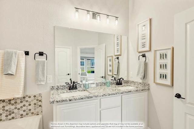 full bath featuring a sink and double vanity