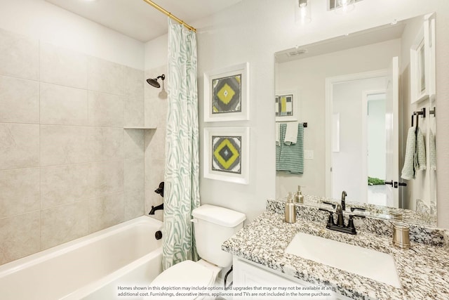 bathroom featuring shower / bath combo, visible vents, vanity, and toilet