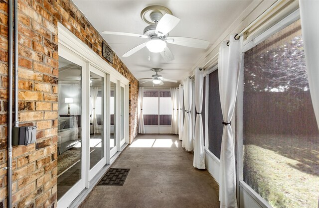 unfurnished sunroom with french doors