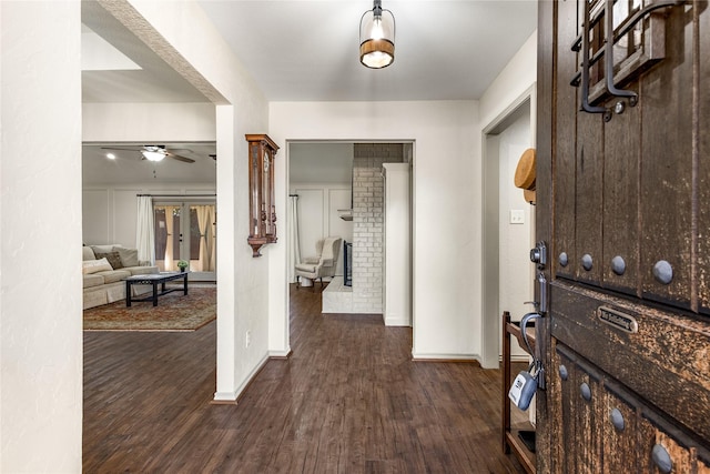 entryway with dark wood-style floors, baseboards, a ceiling fan, and french doors