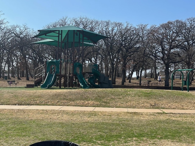 community jungle gym featuring a yard