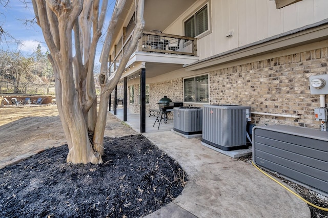 exterior space featuring a balcony and central air condition unit