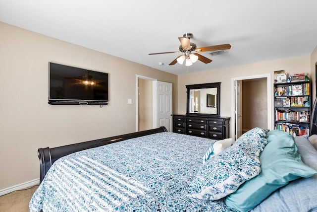 bedroom with carpet floors, a ceiling fan, visible vents, and baseboards