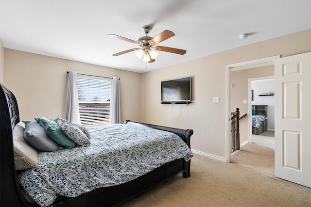 bedroom featuring light carpet, ceiling fan, and baseboards