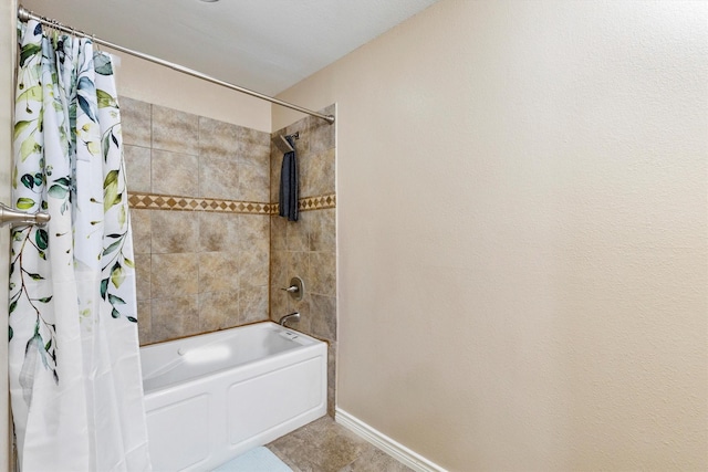 full bath featuring shower / bathtub combination with curtain and baseboards