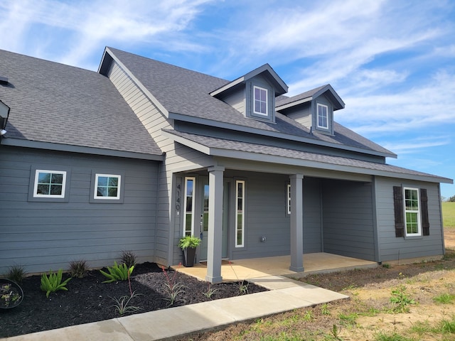 view of front of home with roof with shingles