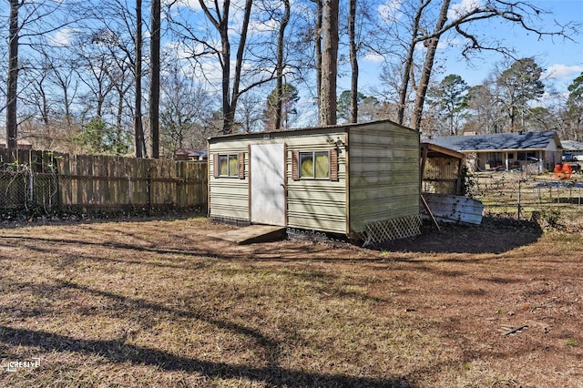 view of shed with a fenced backyard