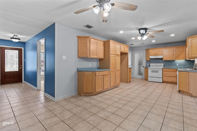 kitchen featuring light tile patterned floors, white electric range oven, visible vents, light countertops, and under cabinet range hood