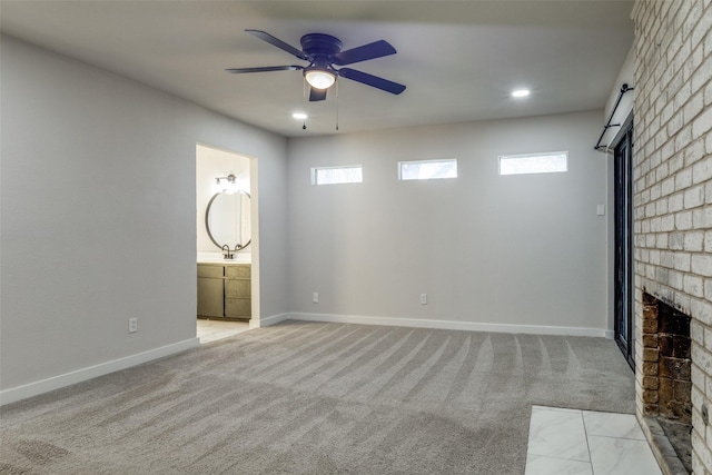 interior space featuring a fireplace, recessed lighting, light colored carpet, a ceiling fan, and baseboards