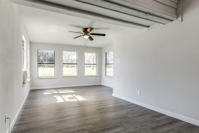 spare room with dark wood-style floors, ceiling fan, and baseboards