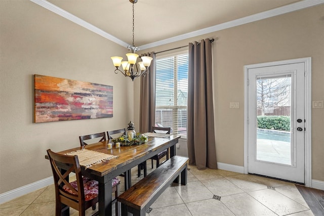 dining room featuring a chandelier, ornamental molding, plenty of natural light, and light tile patterned flooring