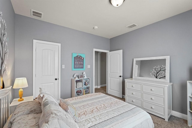 carpeted bedroom featuring visible vents and baseboards