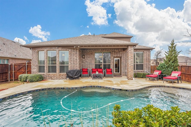 view of swimming pool featuring a patio area, a fenced backyard, and a fenced in pool