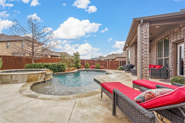 view of pool featuring a fenced in pool, a patio area, a fenced backyard, and an in ground hot tub