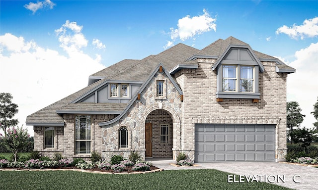 view of front of property featuring driveway, stone siding, a garage, and brick siding