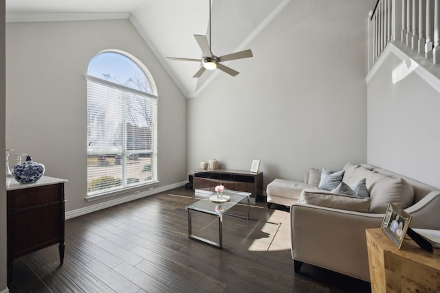 living room featuring dark wood finished floors, ornamental molding, ceiling fan, high vaulted ceiling, and baseboards