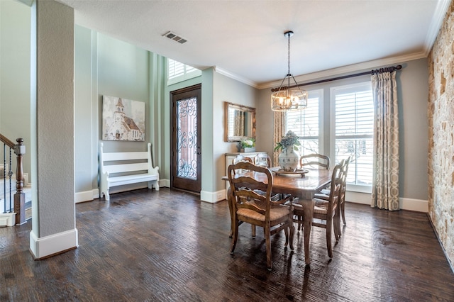 dining area with a chandelier, dark wood-style flooring, visible vents, stairs, and crown molding