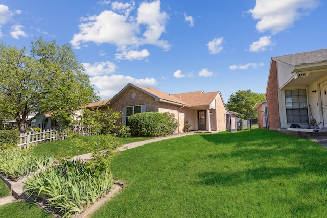 view of property exterior featuring a yard and fence