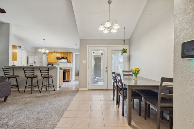 dining room featuring a chandelier, french doors, visible vents, and light tile patterned floors