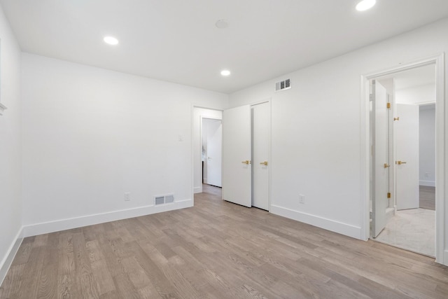 unfurnished bedroom with baseboards, recessed lighting, visible vents, and light wood-style floors