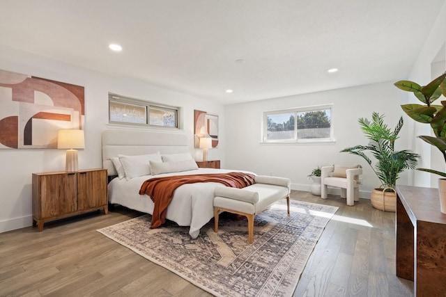 bedroom featuring recessed lighting, baseboards, and light wood finished floors