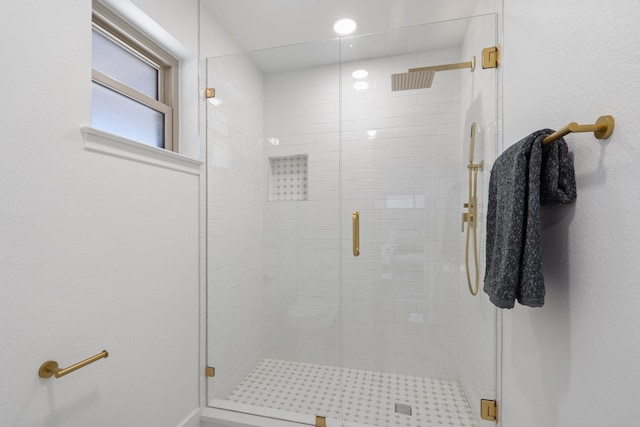 bathroom with a shower stall