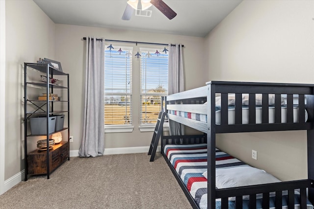 bedroom with a ceiling fan, carpet, visible vents, and baseboards