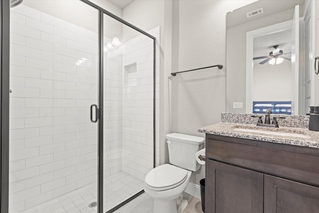 full bath featuring toilet, a stall shower, visible vents, and vanity