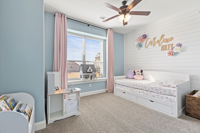 bedroom with baseboards, carpet, visible vents, and a ceiling fan