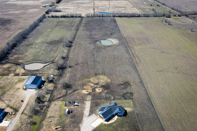 birds eye view of property featuring a rural view