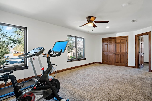 exercise room with carpet floors, recessed lighting, visible vents, and baseboards