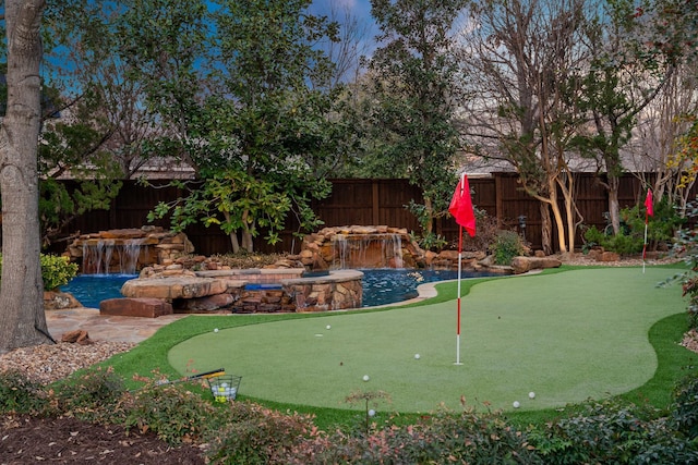 view of property's community featuring a fenced backyard