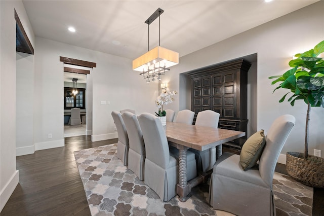 dining area with dark wood-type flooring, recessed lighting, a chandelier, and baseboards