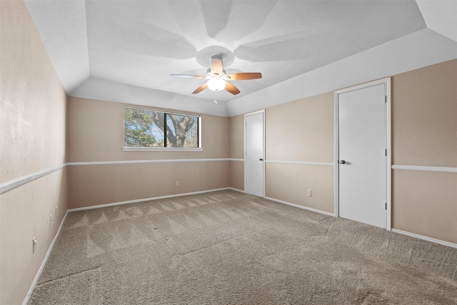 interior space featuring vaulted ceiling, ceiling fan, and baseboards