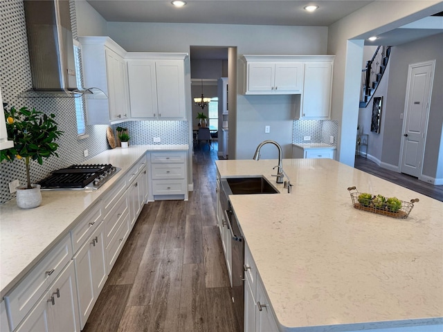 kitchen with white cabinetry, stainless steel gas stovetop, and dark wood-style floors