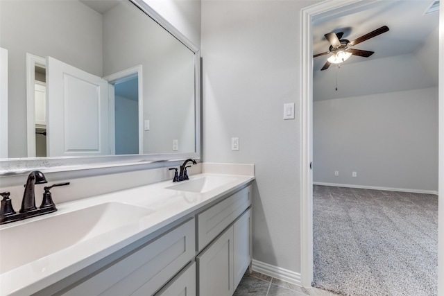 bathroom with a sink, visible vents, double vanity, and a ceiling fan