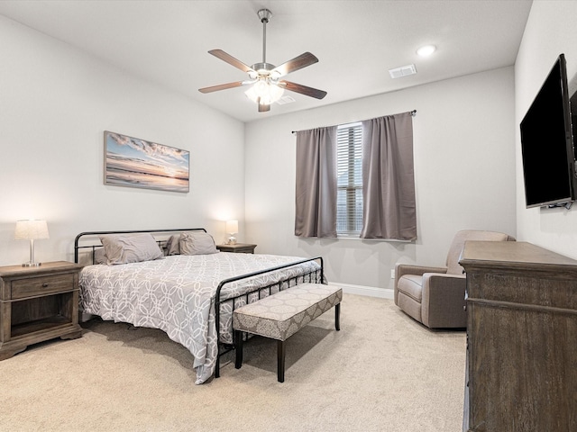 carpeted bedroom featuring visible vents, ceiling fan, and baseboards