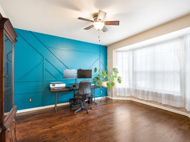 home office with baseboards, ceiling fan, and wood finished floors