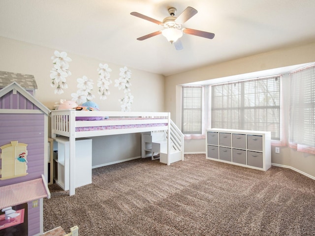 unfurnished bedroom featuring baseboards, carpet floors, and ceiling fan