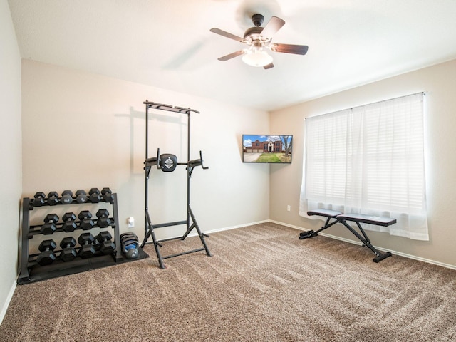 exercise room featuring ceiling fan, baseboards, and carpet floors