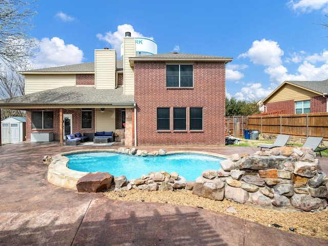 view of swimming pool featuring an outdoor living space, a fenced in pool, ceiling fan, fence, and a patio area