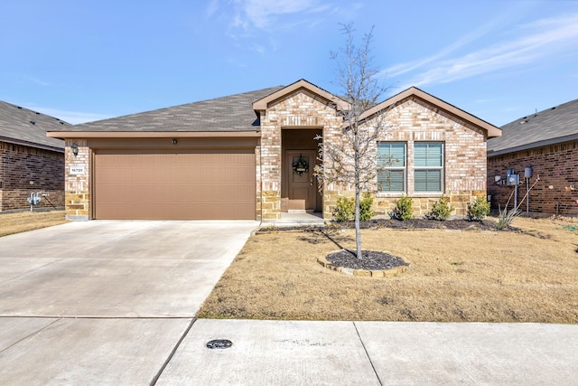 ranch-style home with driveway, stone siding, an attached garage, and brick siding