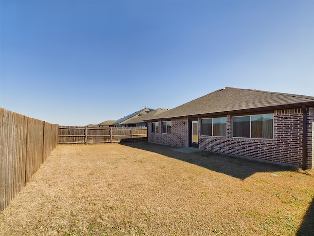 exterior space featuring a fenced backyard