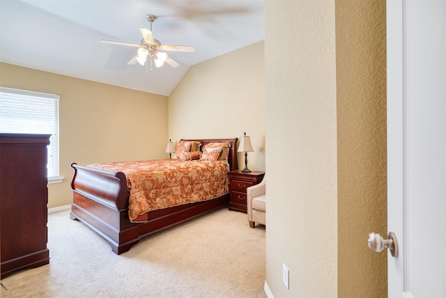 bedroom featuring ceiling fan, carpet, baseboards, and vaulted ceiling