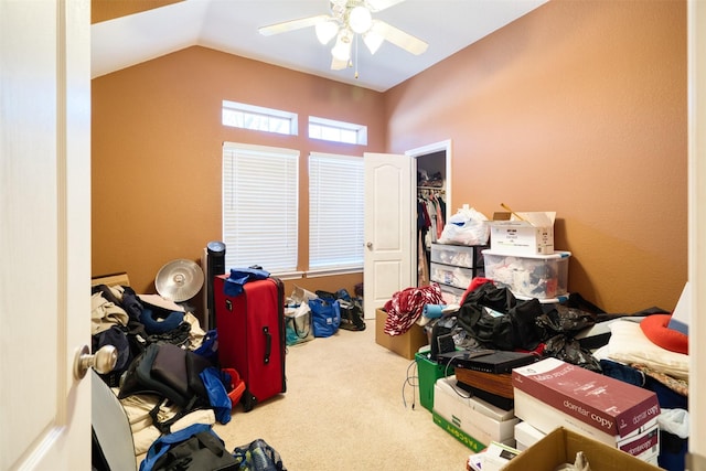 bedroom with a ceiling fan, carpet, and vaulted ceiling