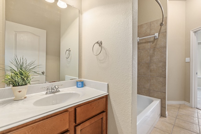 bathroom featuring shower / bathing tub combination, tile patterned flooring, and vanity